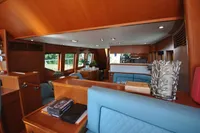 Luxurious interior of 2010 Trader 64 Sunliner yacht with elegant wood finishes.