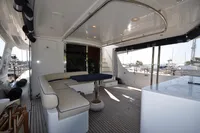 Luxurious 2010 Trader 64 Sunliner yacht interior with elegant seating and modern design.