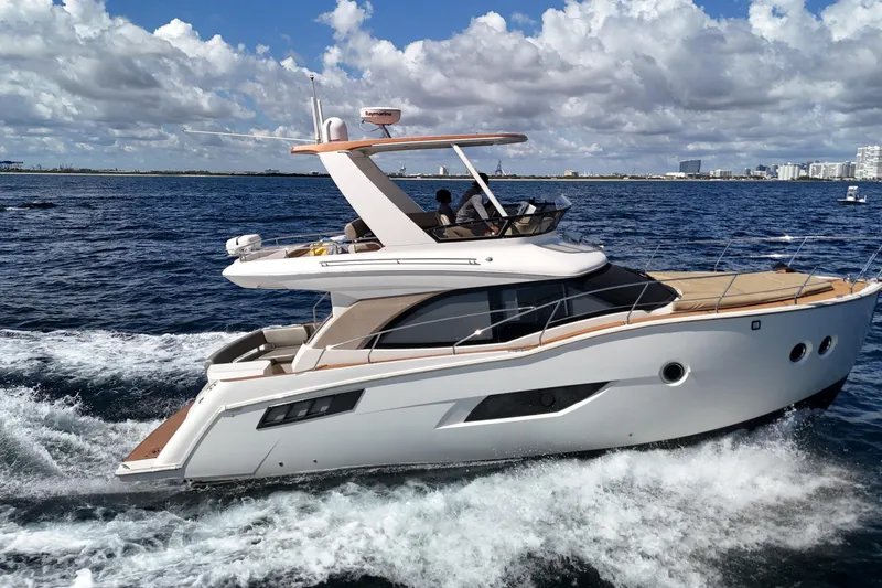  Yacht Photos Pics 2014 Carver 40 Command Bridge yacht cruising on open water under a cloudy sky.