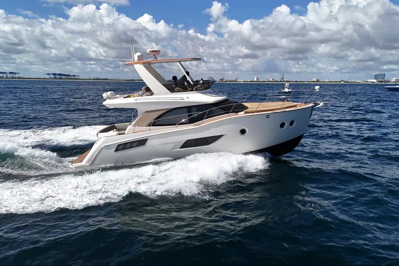  Yacht Photos Pics 2014 Carver 40 Command Bridge yacht cruising on open water under a cloudy sky.