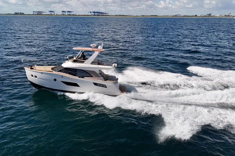  Yacht Photos Pics 2014 Carver 40 Command Bridge yacht cruising on open water.