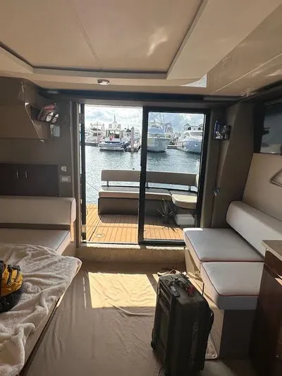  Yacht Photos Pics Interior of 2014 Carver C40 Command Bridge yacht with harbor view through sliding doors.