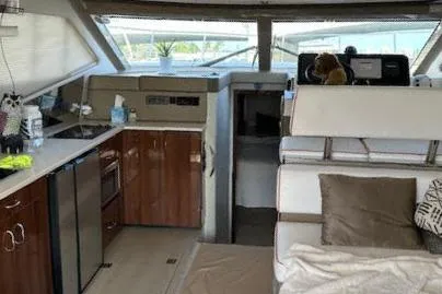  Yacht Photos Pics Interior of 2014 Carver C40 Command Bridge yacht with kitchen and seating area.