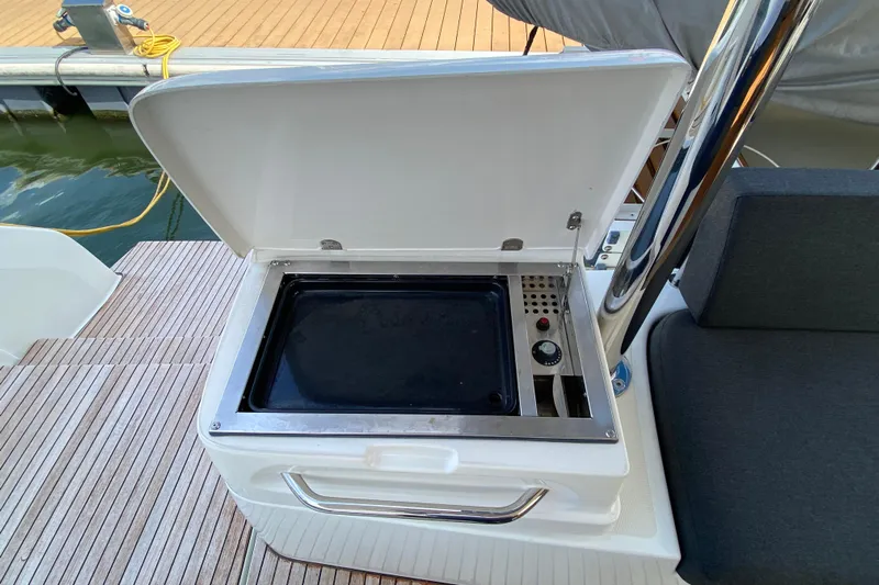  Yacht Photos Pics Outdoor grill on 2022 Lagoon 50 yacht, open lid, dockside view.