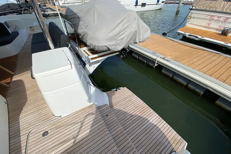  Yacht Photos Pics Lagoon 50 yacht deck, 2022 model, docked at marina with covered equipment.