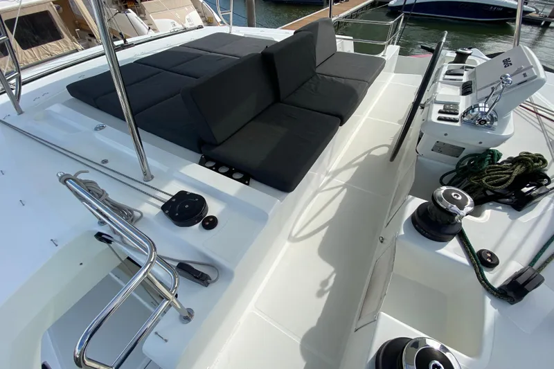  Yacht Photos Pics Luxurious 2022 Lagoon 50 yacht deck with seating and control panel.