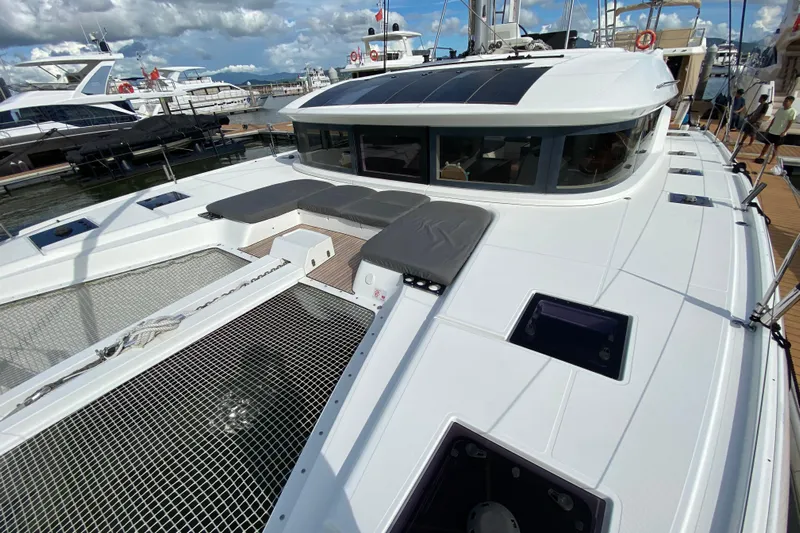 Yacht Photos Pics 2022 Lagoon 50 catamaran docked, featuring spacious deck and modern design.