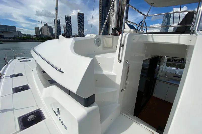  Yacht Photos Pics 2022 Lagoon 50 catamaran deck with city skyline in the background.