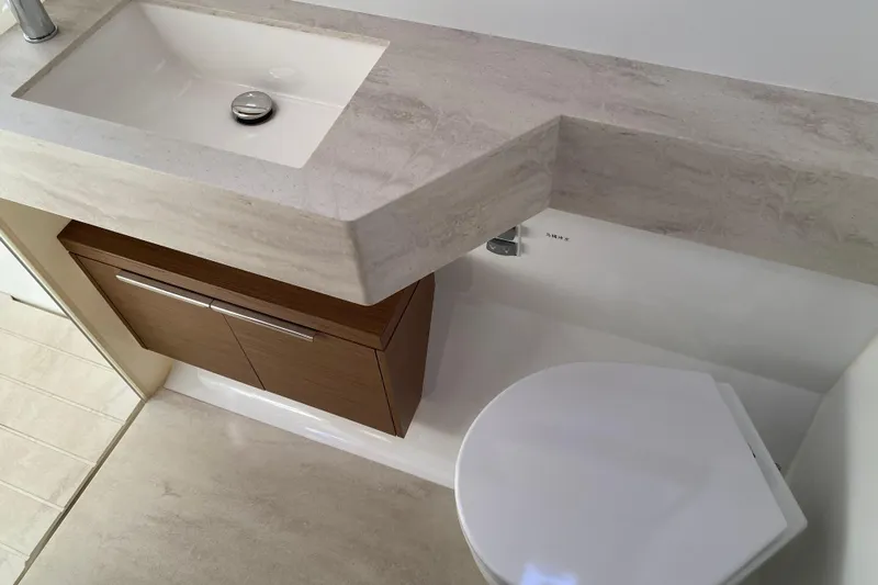  Yacht Photos Pics Modern bathroom in 2022 Lagoon 50 yacht with sink and toilet.