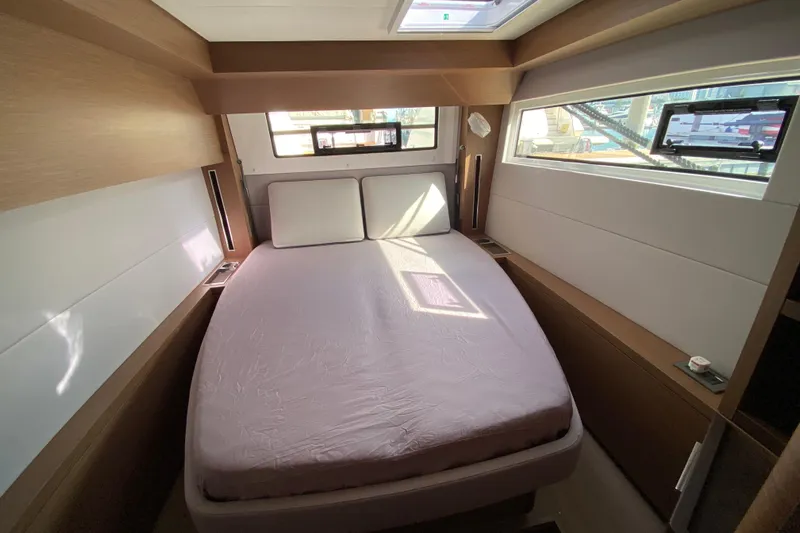  Yacht Photos Pics Luxurious cabin interior of 2022 Lagoon 50 yacht with modern design and ample natural light.