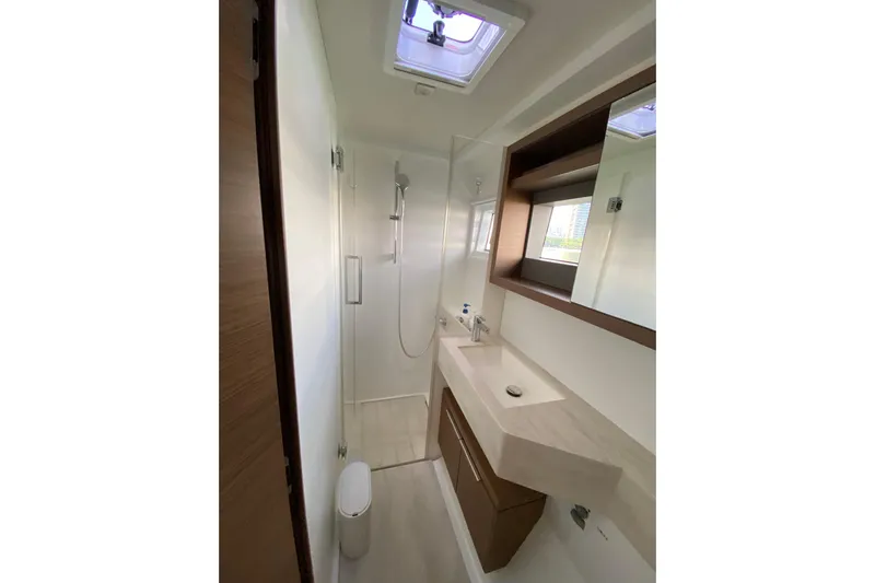  Yacht Photos Pics Modern bathroom interior on 2022 Lagoon 50 yacht, featuring sleek design and fixtures.