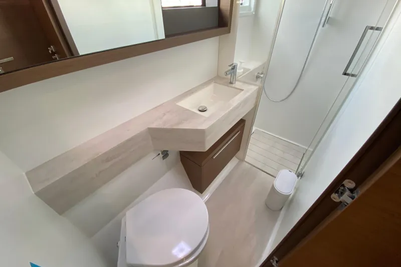  Yacht Photos Pics Modern bathroom in 2022 Lagoon 50 yacht with sleek sink and shower.