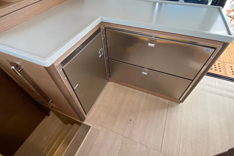  Yacht Photos Pics Modern kitchen area in a 2022 Lagoon 50 yacht with stainless steel appliances.