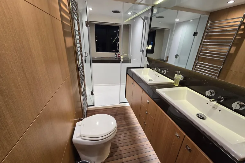  Yacht Photos Pics Luxurious bathroom on 2011 Princess 72 yacht with dual sinks and modern shower.
