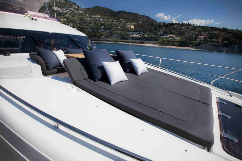  Yacht Photos Pics Luxurious 2011 Princess 72 yacht with sunbathing deck and scenic coastal view.