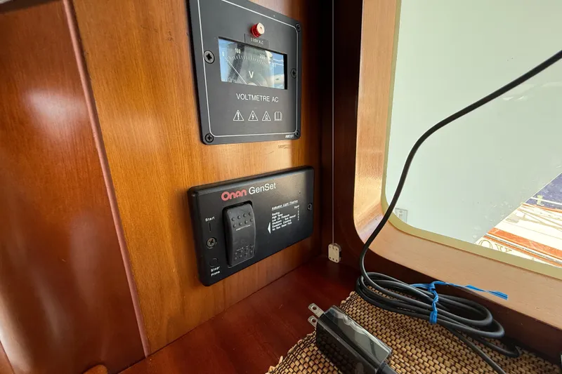 All At Sea Yacht Photos Pics Control panel on 2007 Beneteau Swift Trawler 42 with voltmeter and Onan GenSet.