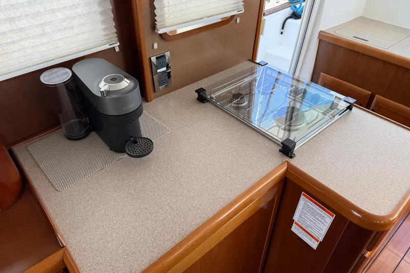 All At Sea Yacht Photos Pics 2007 Beneteau Swift Trawler 42 kitchen with coffee maker and stove.