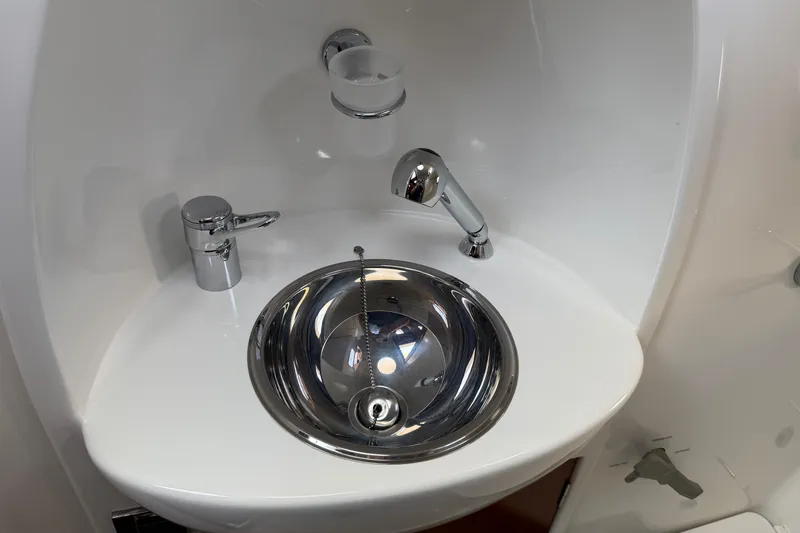 All At Sea Yacht Photos Pics Stainless steel sink in 2007 Beneteau Swift Trawler 42 bathroom.