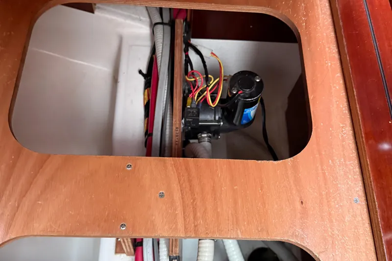 All At Sea Yacht Photos Pics Bilge pump system inside 2007 Beneteau Swift Trawler 42, showcasing wiring and components.