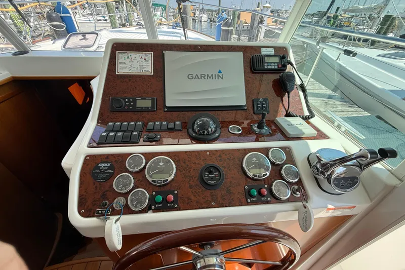All At Sea Yacht Photos Pics Helm of 2007 Beneteau Swift Trawler 42 with Garmin navigation system and control panel.