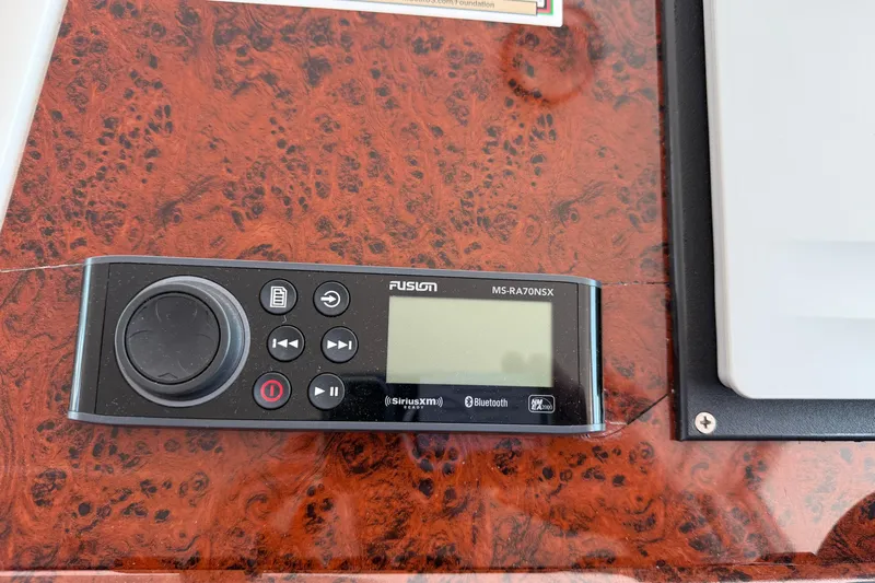 All At Sea Yacht Photos Pics Fusion MS-RA70NSX stereo system on 2007 Beneteau Swift Trawler 42 dashboard.