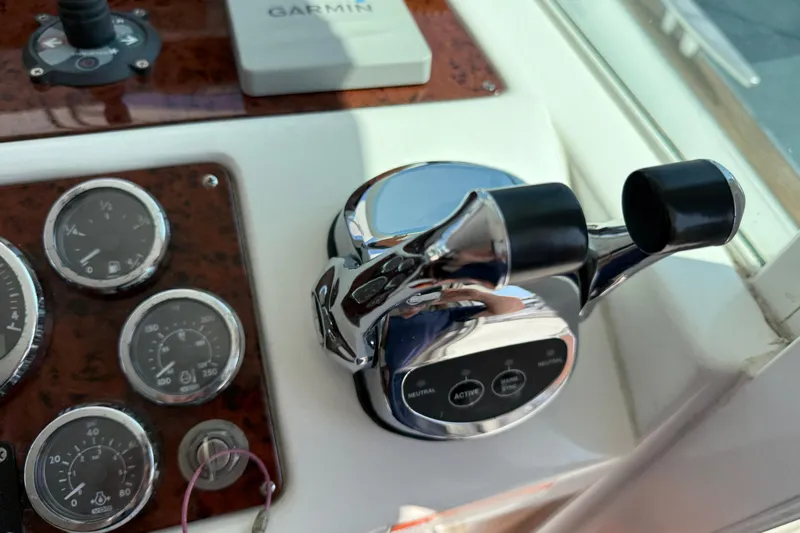 All At Sea Yacht Photos Pics Control panel of a 2007 Beneteau Swift Trawler 42 with gauges and throttle levers.