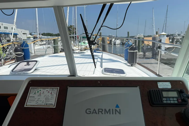 All At Sea Yacht Photos Pics 2007 Beneteau Swift Trawler 42 helm with Garmin navigation, docked at marina.