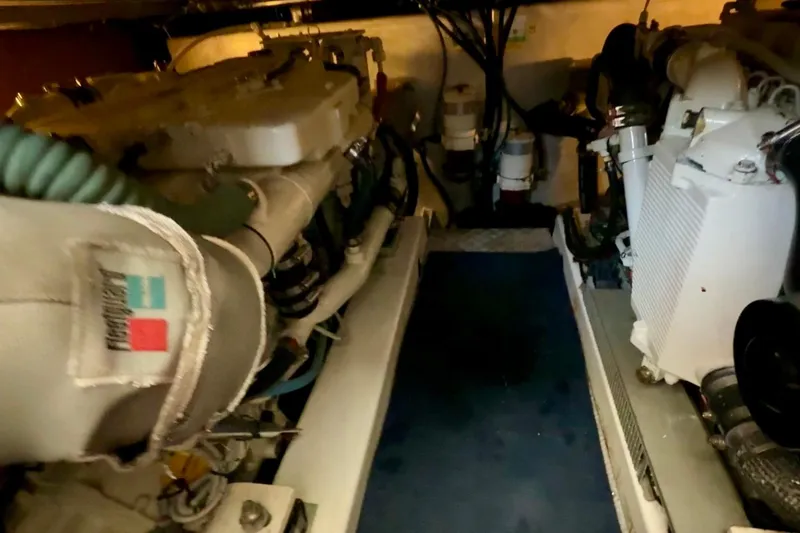 All At Sea Yacht Photos Pics Engine room of a 2007 Beneteau Swift Trawler 42, showcasing mechanical components.