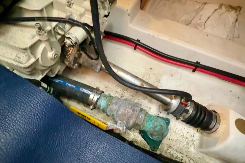 All At Sea Yacht Photos Pics Engine compartment of a 2007 Beneteau Swift Trawler 42, showing mechanical components and wiring.