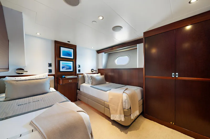 Rule No. 1 Yacht Photos Pics Luxurious cabin interior of 2011 Westport 40 meter yacht with twin beds and elegant wood finishes.