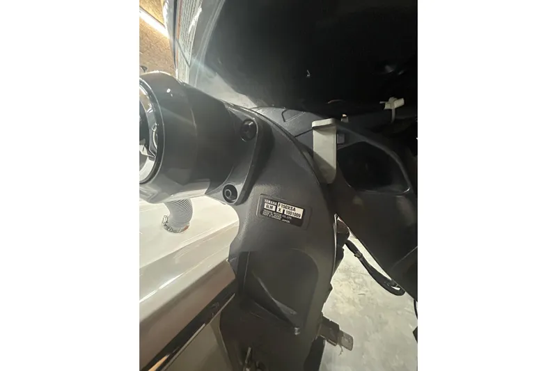  Yacht Photos Pics Close-up of a 2024 Contender 24 Sport boat engine component.