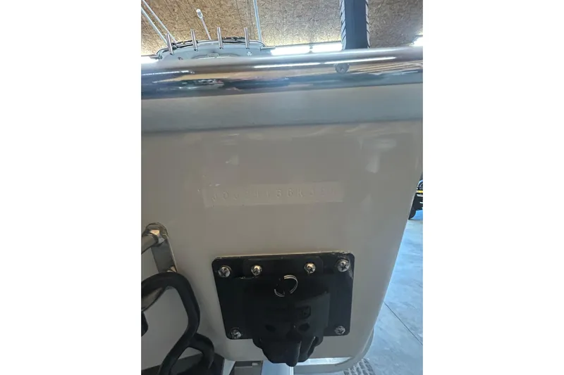  Yacht Photos Pics 2024 Contender 24 Sport boat transom detail in a showroom setting.