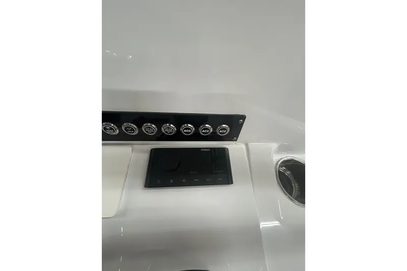  Yacht Photos Pics 2024 Contender 24 Sport dashboard with control panel and cup holder.