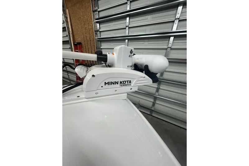  Yacht Photos Pics Minn Kota Terrova trolling motor on 2024 Contender 24 Sport boat in garage.