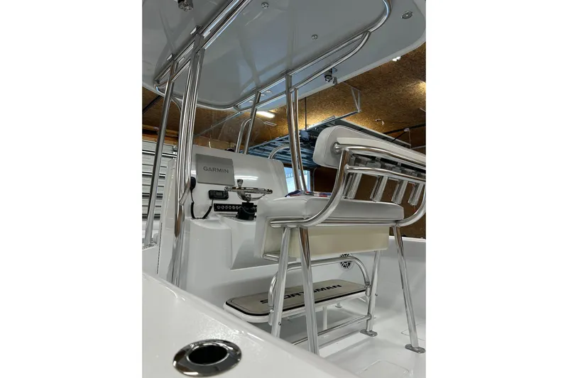  Yacht Photos Pics 2024 Contender 24 Sport boat interior with Garmin equipment and sleek seating design.