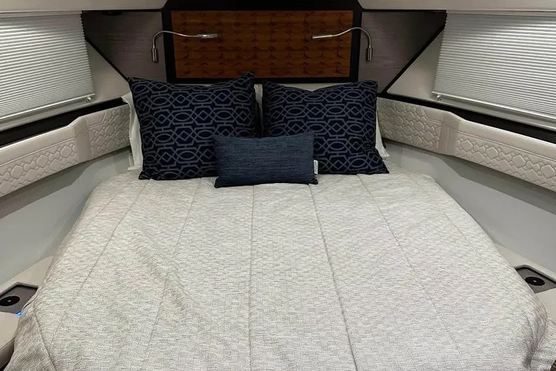 Only 113 Hours Yacht Photos Pics Luxurious 2023 Tiara Yachts 43 LS cabin interior with elegant bedding and pillows.