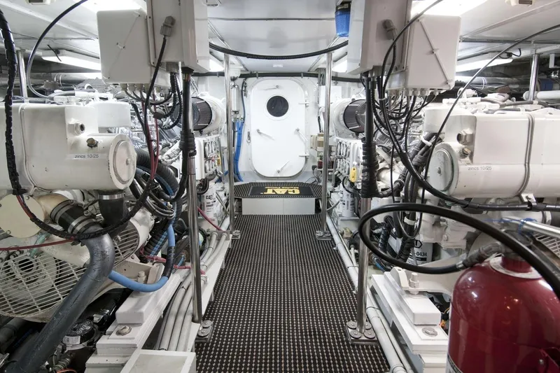 Compass Rose Yacht Photos Pics Engine room of a 1995 Custom Heisley boat, featuring machinery and equipment.
