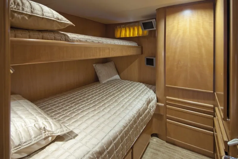 Compass Rose Yacht Photos Pics Luxurious 1995 Custom Heisley yacht cabin with cozy bunk beds and elegant wood finish.