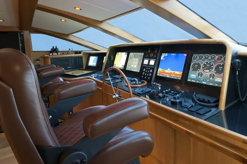 Compass Rose Yacht Photos Pics Luxurious 1995 Custom Heisley yacht cockpit with advanced navigation controls and leather seating.