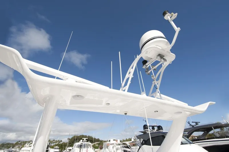 Compass Rose Yacht Photos Pics Custom 1995 Heisley boat with radar equipment against a clear blue sky.