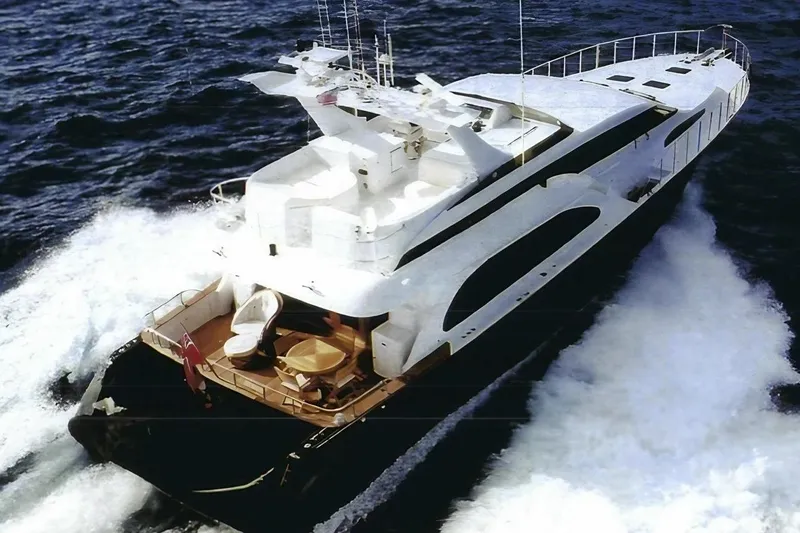 Compass Rose Yacht Photos Pics Luxurious 1995 Custom Heisley yacht cruising on open sea, aerial view.