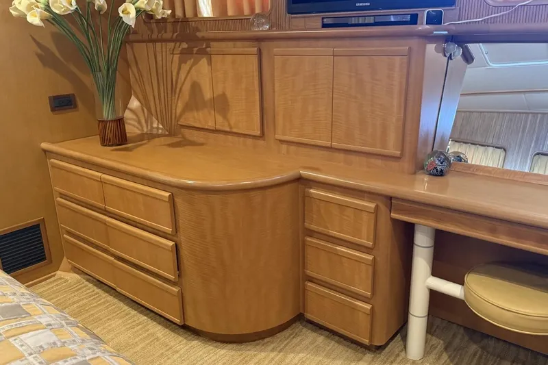 Compass Rose Yacht Photos Pics Luxurious wooden cabinetry in a 1995 Heisley Flybridge yacht interior.