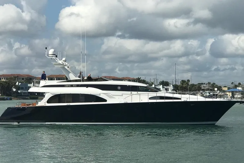 Compass Rose Yacht Photos Pics Luxurious 1995 Heisley Flybridge yacht cruising on a sunny day.