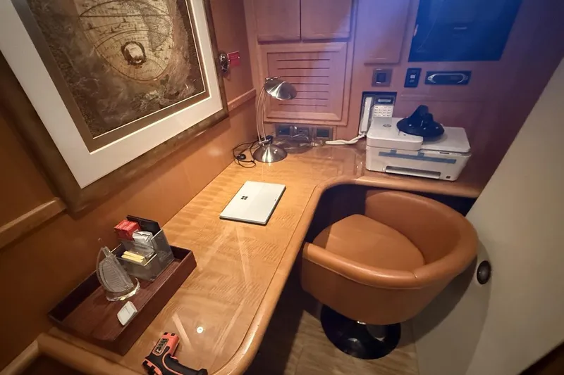 Compass Rose Yacht Photos Pics Office space on a 1995 Heisley Flybridge yacht with desk, chair, and equipment.