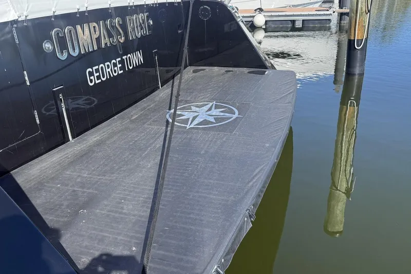 Compass Rose Yacht Photos Pics Stern view of 1995 Heisley Flybridge yacht "Compass Rose" docked in George Town.