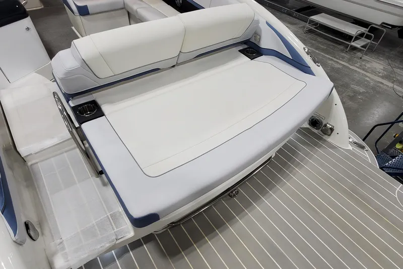  Yacht Photos Pics 2020 Formula 310 Bowrider boat interior with white seating and cup holders.