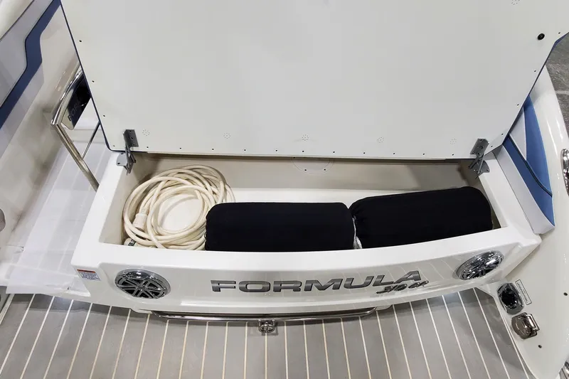  Yacht Photos Pics 2020 Formula 310 Bowrider storage compartment with coiled rope and cushions.