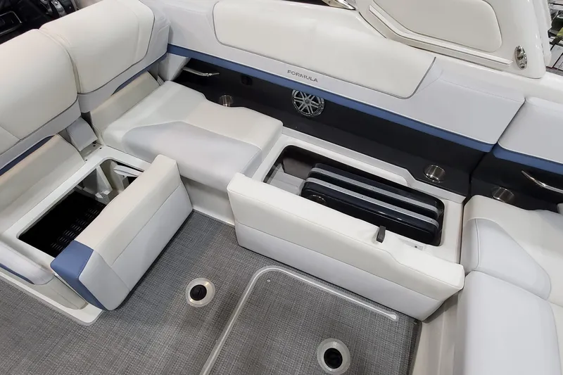  Yacht Photos Pics 2020 Formula 310 Bowrider interior with open storage compartments and cushioned seating.