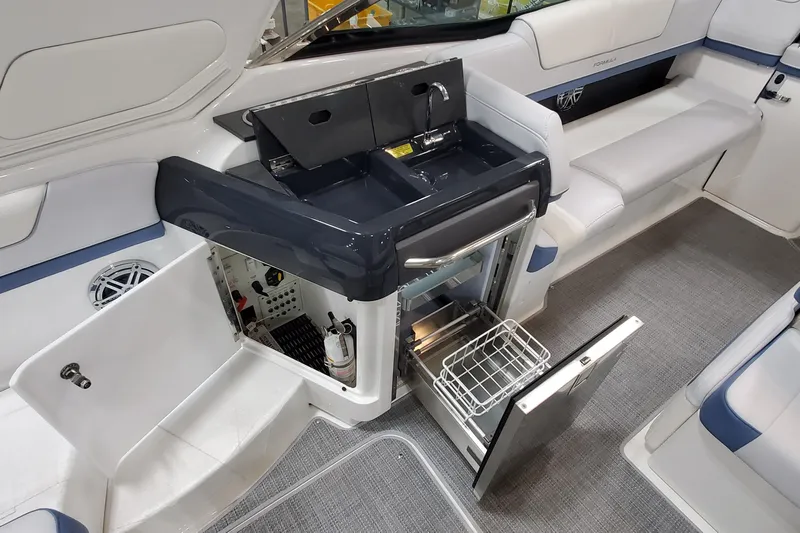  Yacht Photos Pics 2020 Formula 310 Bowrider interior with sink, storage, and seating area.