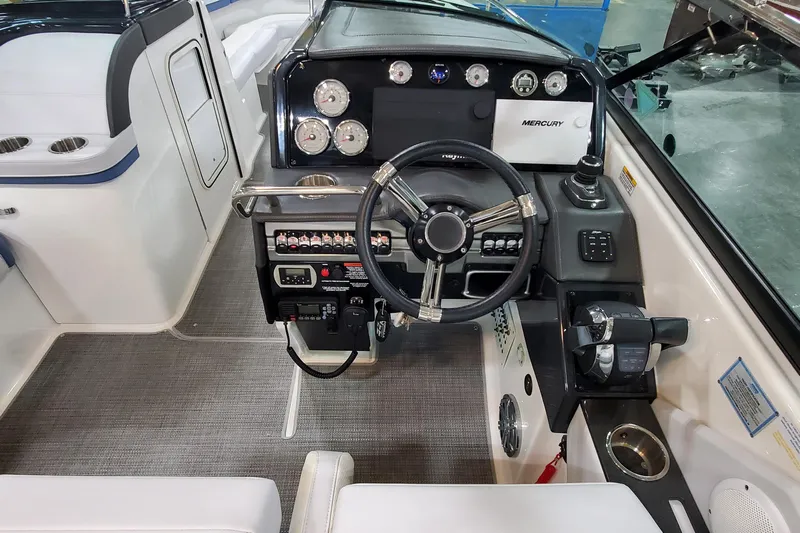  Yacht Photos Pics 2020 Formula 310 Bowrider dashboard with steering wheel and control panel.